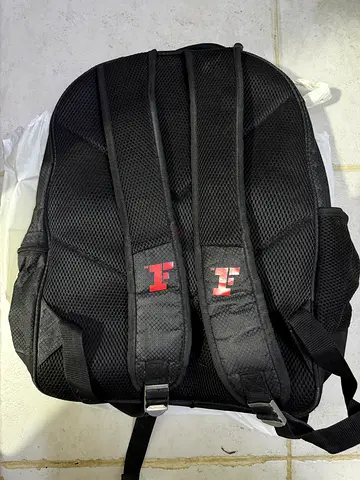 Black padded backpack with breathable mesh straps