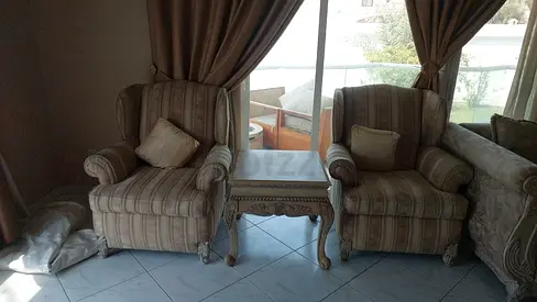 Pair of striped upholstered armchairs with matching side table - good condition
