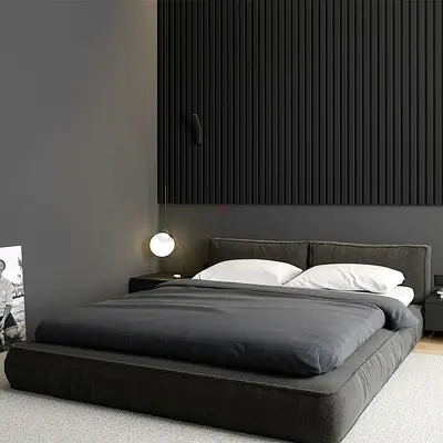Low-profile modern platform bed with dark grey upholstery