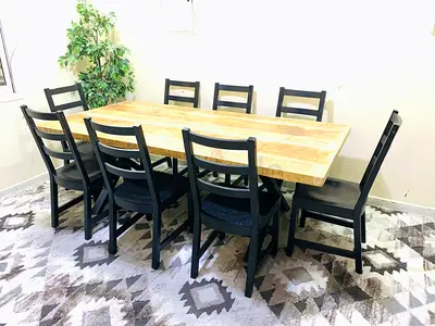 Solid Wood Dining Table with 8 Black Ladder-Back Chairs