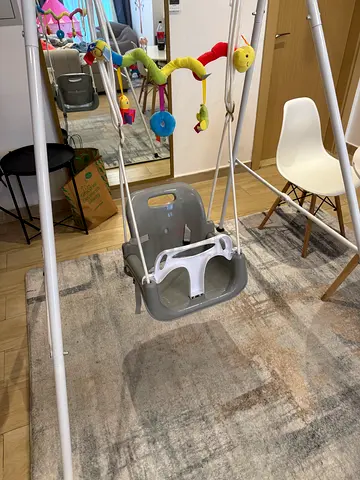 Sturdy Baby Swing with Safety Harness and Activity Toy
