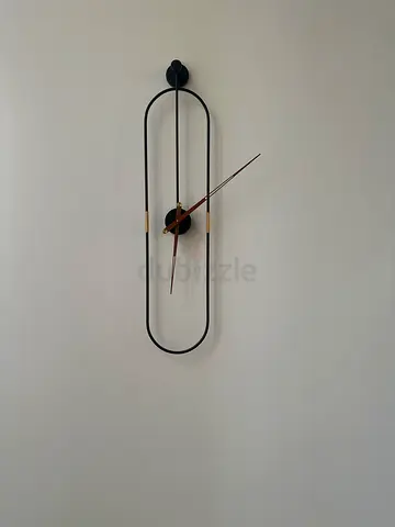 Modern minimalist oval wall clock - black and brass finish