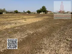 Land for sale in Ajman, Al Zahia area, residential/investment, G+2 (floor level), 8600 sq ft, corner