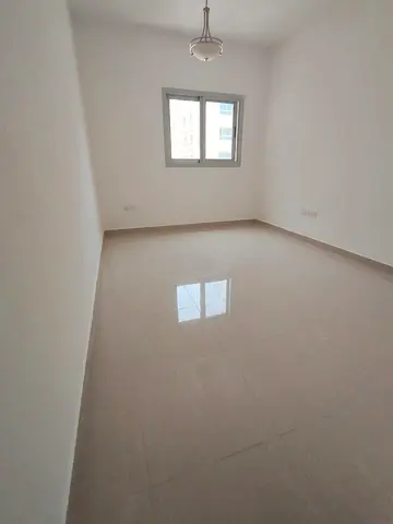 **Annual Rental – Al Taawun, Sharjah** Spacious **2-bedroom apartment** with a **living room, hallway, and balcony**, offering generous living space