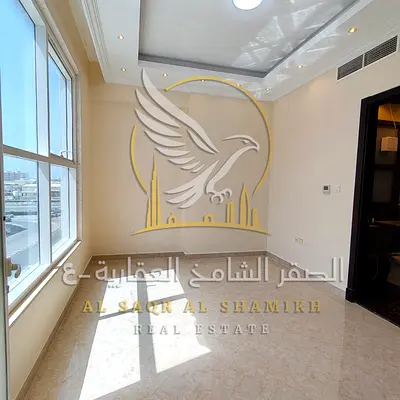 For annual rent in Ajman a two-bedroom apartment in Al Rawda 3 featuring two bathrooms a balcony with a view modern finishes excellent space private