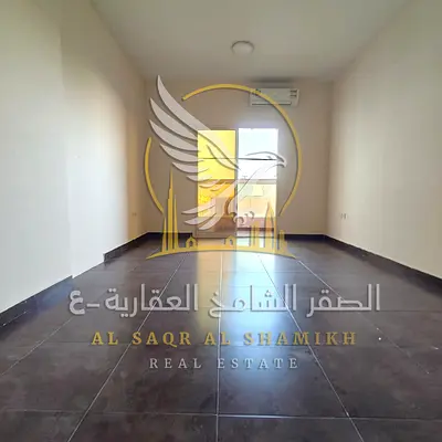 Two-bedroom apartment with a living room in Al Rashidiya Ajman for annual rent Prime location elegant design competitive price and easy access to Duba