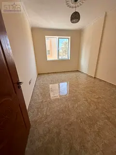 One-bedroom apartment with a lounge for annual rent in Al-Rashidiya 2