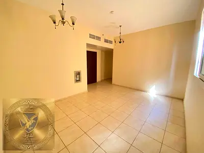 Two bedroom hall open view central AC free maintenance renovated building sandy parking easy payment close to Corniche