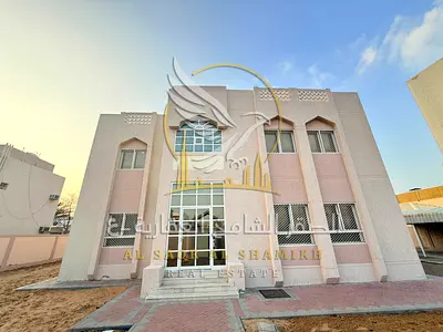 Villa for annual rent in Al Jurf 1, Ajman, featuring five bedrooms, six bathrooms, a spacious living room, and a large majlis. Exceptional value.