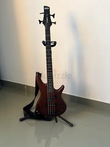 4-String Electric Bass Guitar with Strap and Stand - Excellent Condition
