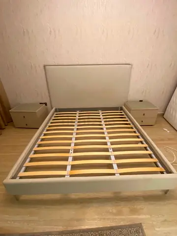 Queen size upholstered bed frame with slats and two bedside tables