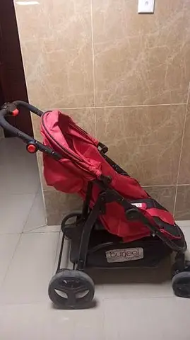 Red lightweight baby stroller/pram in good used condition