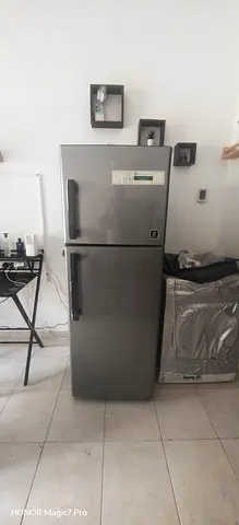 Silver double-door refrigerator, good working condition