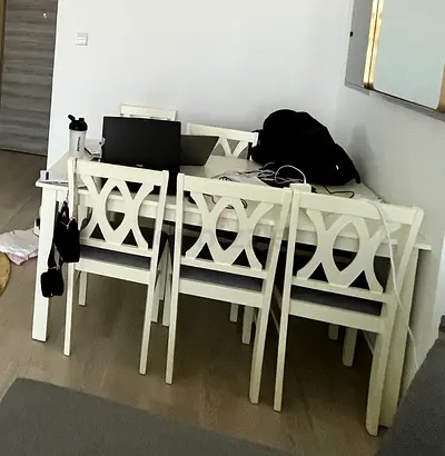 White wooden dining table with 6 matching chairs - good condition