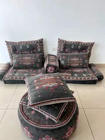 Low Arabic-style floor seating set with cushions and pouf
