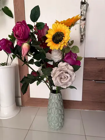 Artificial flower arrangement in decorative vase - ready to display