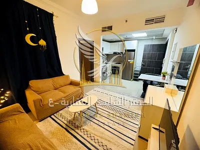 استوديو مفروش للايجار الشهري مع جيم ومسبح وشامل فواتير في برج الساعة  الراشدية 1 بموقع مميز قريب من سفير مول وجمعية أسواق عجمان