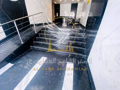 For annual rent in Ajman Al Nuaimiya a two bedroom apartment with a living room three bathrooms and a balcony with an open view Modern finishing ready