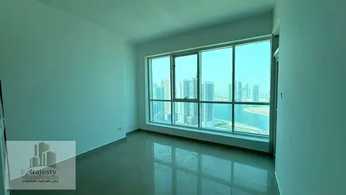 For rent: an apartment with a direct panoramic view of Al Qasba Canal and Al Mamzar Lake in Sharjah, elegant finishes, a prime location, and an unobst