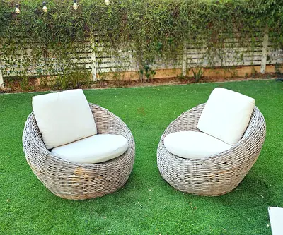 Round rattan outdoor lounge chairs with cushions