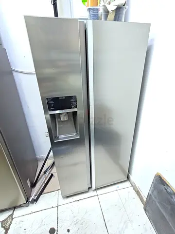 Samsung Side-by-side stainless steel refrigerator with water dispenser