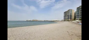 Al Zeina, fully furnised room in large sea view apartment.