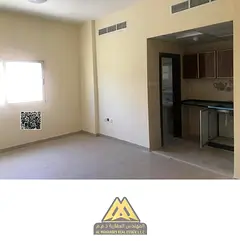 Studio for annual rent in Rashidiya 2, behind Falcon Towers, central AC, family building, AED 18,000