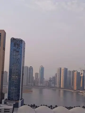 Annual Rent in Sharjah Al Taawun Spacious three bedroom apartment with hall and balcony overlooking the lake master bedroom three bathrooms kitchen bu