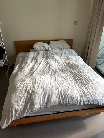 Wooden double bed frame with mattress — good condition
