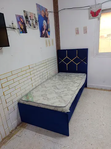 Single blue upholstered bed with mattress - good quality