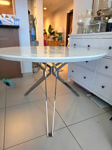 Round white dining table with metal folding legs - sturdy, compact