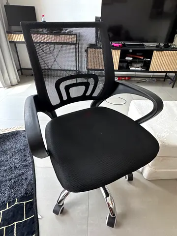 Black ergonomic mesh office chair with lumbar support, good condition