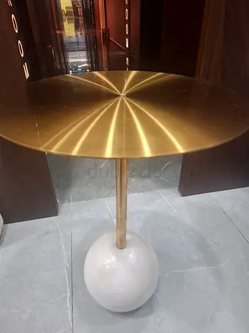 Slim marble coffee side table with brass top.