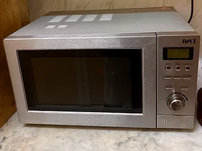 Used First 1 Stainless Steel Microwave Oven - Perfect Working Condition