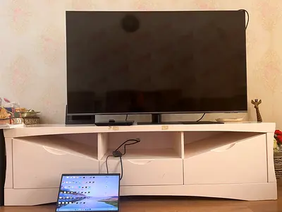 TV stand suitable for 55-65 inch tvs with 3 compartments and 3 draws- good working condition