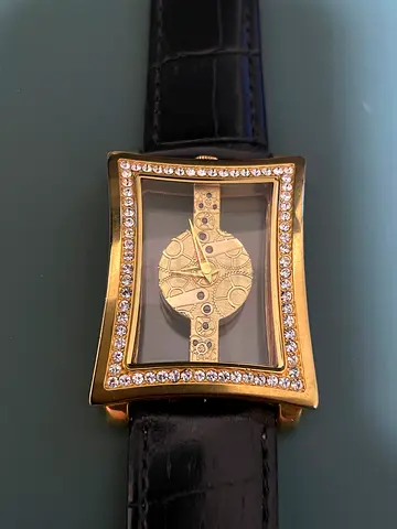 Gold-tone Skeleton Mechanical Watch with Crystal Bezel on Black Leather Strap