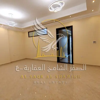 Annual rental apartment in Al Rawda 3 with three bedrooms, living room, storage room, three bathrooms, central AC, private parking and luxury building