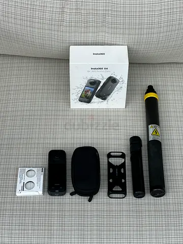 Insta360 ONE X2 action camera with accessories (selfie stick, mounts, case)