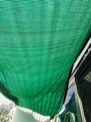 MOVING OUT SALE: Green outdoor shade cloth / sun sail (approx. 3 x 4 m)