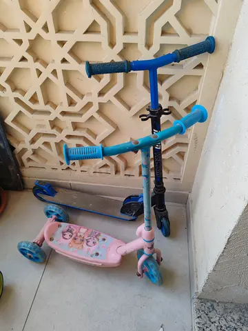 Lot of 2 Kids Scooters — adjustable heights mixed sizes, good used condition.