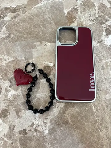 Burgundy glossy iPhone case with detachable heart bead strap