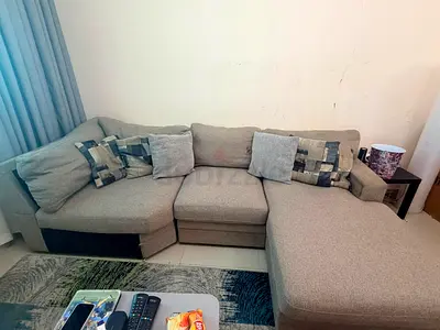 Light grey L-shaped fabric sofa with chaise, 4-seater