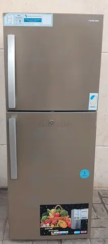 Double Door Nikai Refrigerator, color grey, condition working good.
