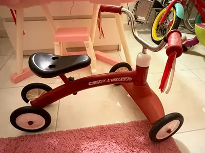 Red toddler ride-on walker / balance tricycle - good condition