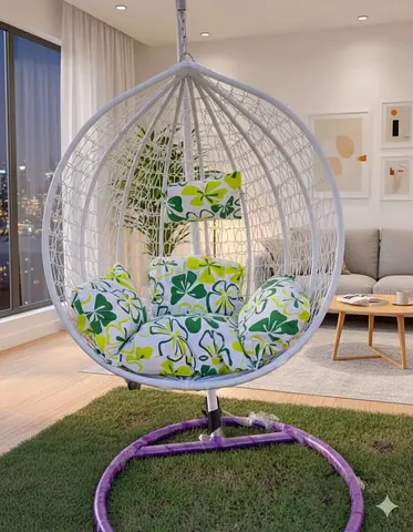 White Rattan Hanging Egg Chair with Green Floral Cushions