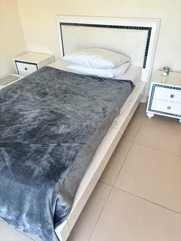 Stylish Twin bed white bed frame with side tables, dresser, study table and mirror - good condition