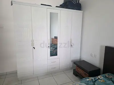 White 4-Door Wardrobe with Mirror and Drawers - Good Condition