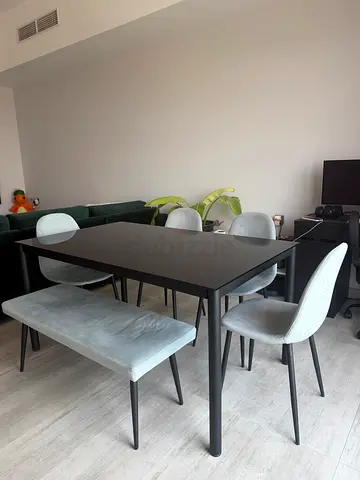 Modern black dining table with 4 upholstered chairs and bench - good condition
