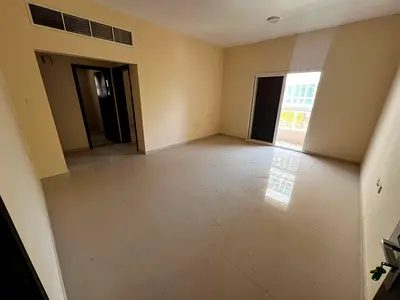 One bedroom and living room, balcony, central air conditioning, prime location near the Corniche, easy access to Sharjah and Dubai.
