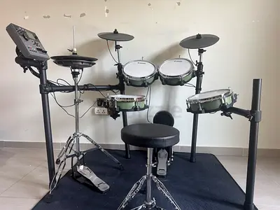 Donner DED-500Pro Electronic Drum Kit with stool, high-hat, and kick pedal.